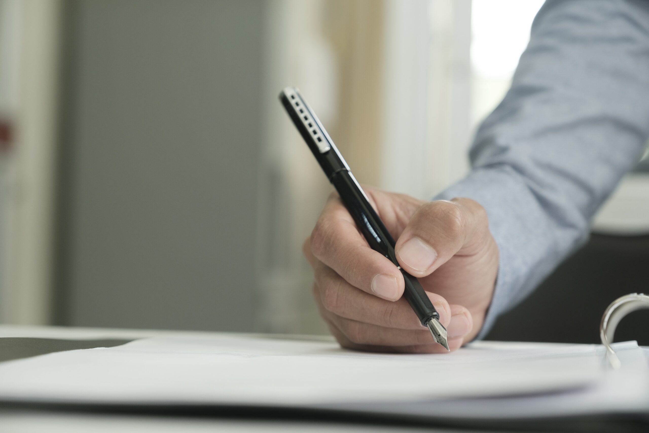 businessman-signs-a-contract-2023-11-27-05-08-03-utc-min